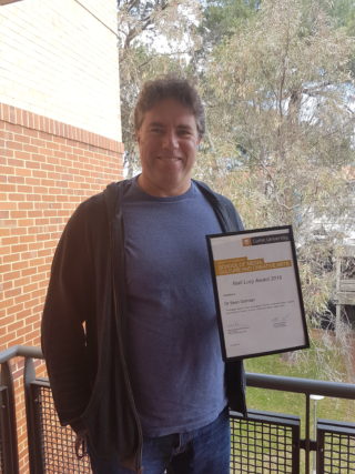 Sean Gorman holding the award