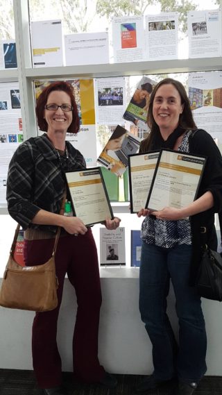 Katie Ellis and Eleanor Sandry with awards