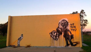 'we own you' street art