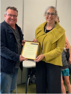 Mike Kent presenting Dawn Bennett with her Humanities Research Award 2020