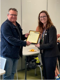 Mike Kent presenting Katie Ellis with her 2020 Humanities Research Award