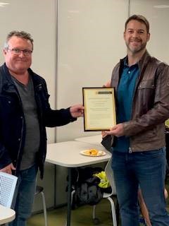 Mike Kent presenting Stuart Bender with his 2020 Humanities Research Award