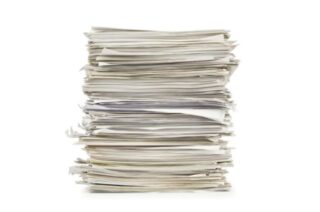 Photograph of a high stack of white A4 papers