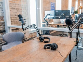 Desk with mounted unattended microphone and headset like a media office