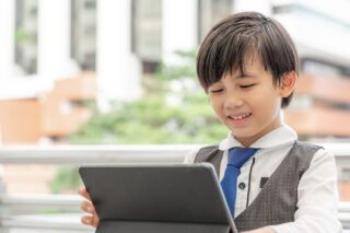 young boy using an laptop/tablet